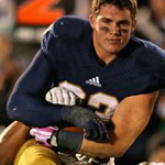 Notre Dames cam Mcdaniel looks like a model while getting tackled against usc