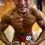 Feng Qing Yu prepares for an amateur bodybuilding competition in Zhejiang