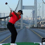 Tiger Woods hits a shot from Asia to Europe in Turkey