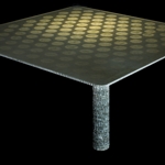 Honeycomb<br>Tavolo basso<br>Prototipo realizzato da Bufalini Marmi - 2010<br>E' realizzato utilizzando un unico foglio di Honeycomb di alluminio di 1250 x 2500 mm.<br>L'Honeycomb  un sandwich di due fogli di resina con all'interno un alveolare di alluminio, solitamente  usato all'interno delle imbarcazioni da diporto per alleggerire il marmo dei rivestimenti. In questo caso  stato utilizzato per le sue qualit strutturali ed estetiche.<br>Il foglio  stato diviso in due met successivamente accoppiate tra loro. Sulla met inferiore sono stati praticati dei fori i cui scarti, assemblati verticalmente, vanno a costituire le gambe del tavolo.<br>Per la sua realizzazione non viene prodotto alcuno scarto di materiale lavorato.<br>Esiste anche un modello con un sottile piano in marmo bianco di Carraraaccoppiato al pannello di Honeycomb