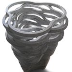 Vaso Vago - Vaso in marmo - Produzione Up-group, 2008. Questo vaso apparentemente non ci rivela una sua logica interna. La sua forma finale invece é la naturale conseguenza della modalità di lavorazione con cui sono stati ottenuti i pezzi che lo compongono. I 24 anelli che formano il vaso sono ricavati da tre lastre di cm. 60 x 60 in marmo bianco di Carrara tagliate a getto d'acqua. La disposizione concentrica degli anelli sulla lastra consente di ridurre nei limiti del possibile gli scarti di materiale lavorato