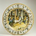 Piatto da pompa con raffaellesche e istoriato con Gioco delle Mete - Maiolica, Urbino, officina di Antonio Patanazzi, 1580 ca. - Diam cm. 47,8 - Faenza, Museo Internazionale delle Ceramiche