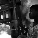 General News: 1st prize singles - Riccardo Venturi, Italy, Contrasto - Old Iron Market burns, Port-au-Prince, Haiti, 18 January